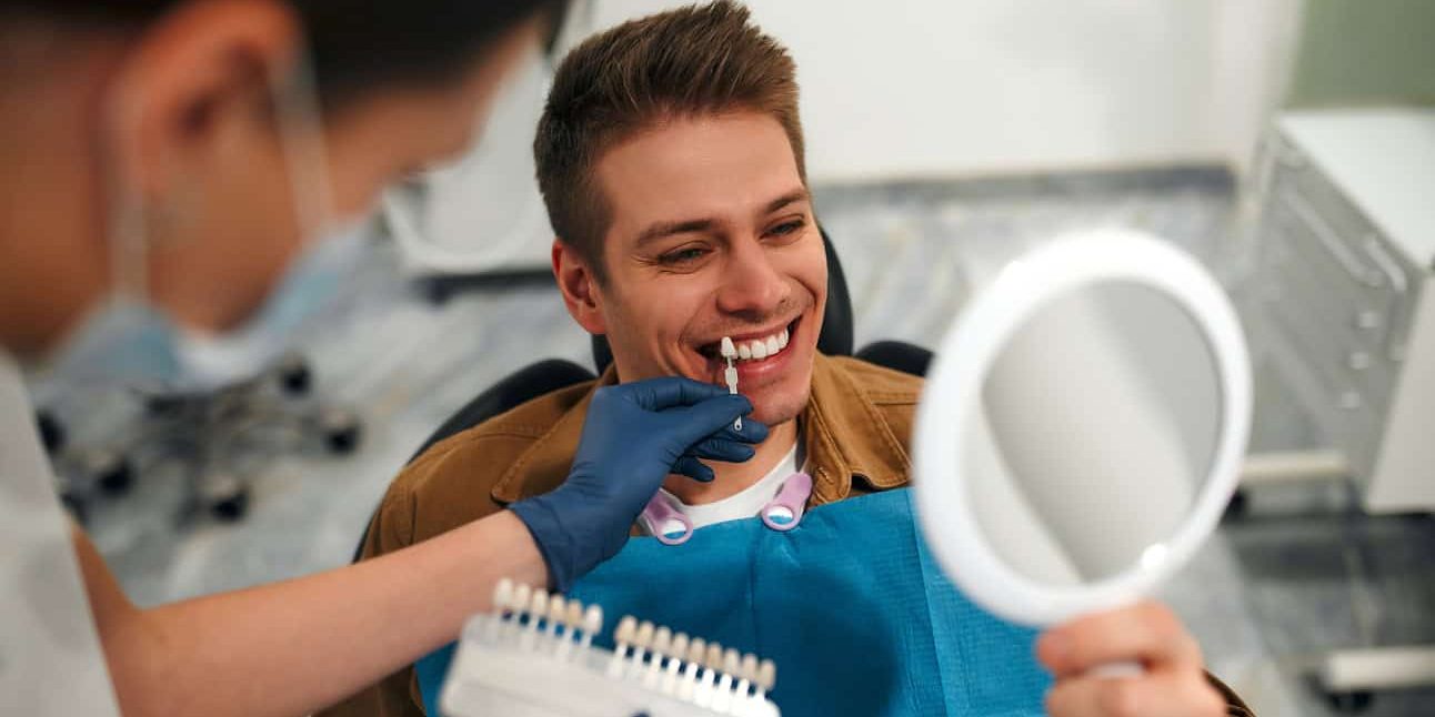 Dentist checking teeth enamel